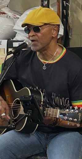 Mike Gaskins performing with acoustic guitar and vocals